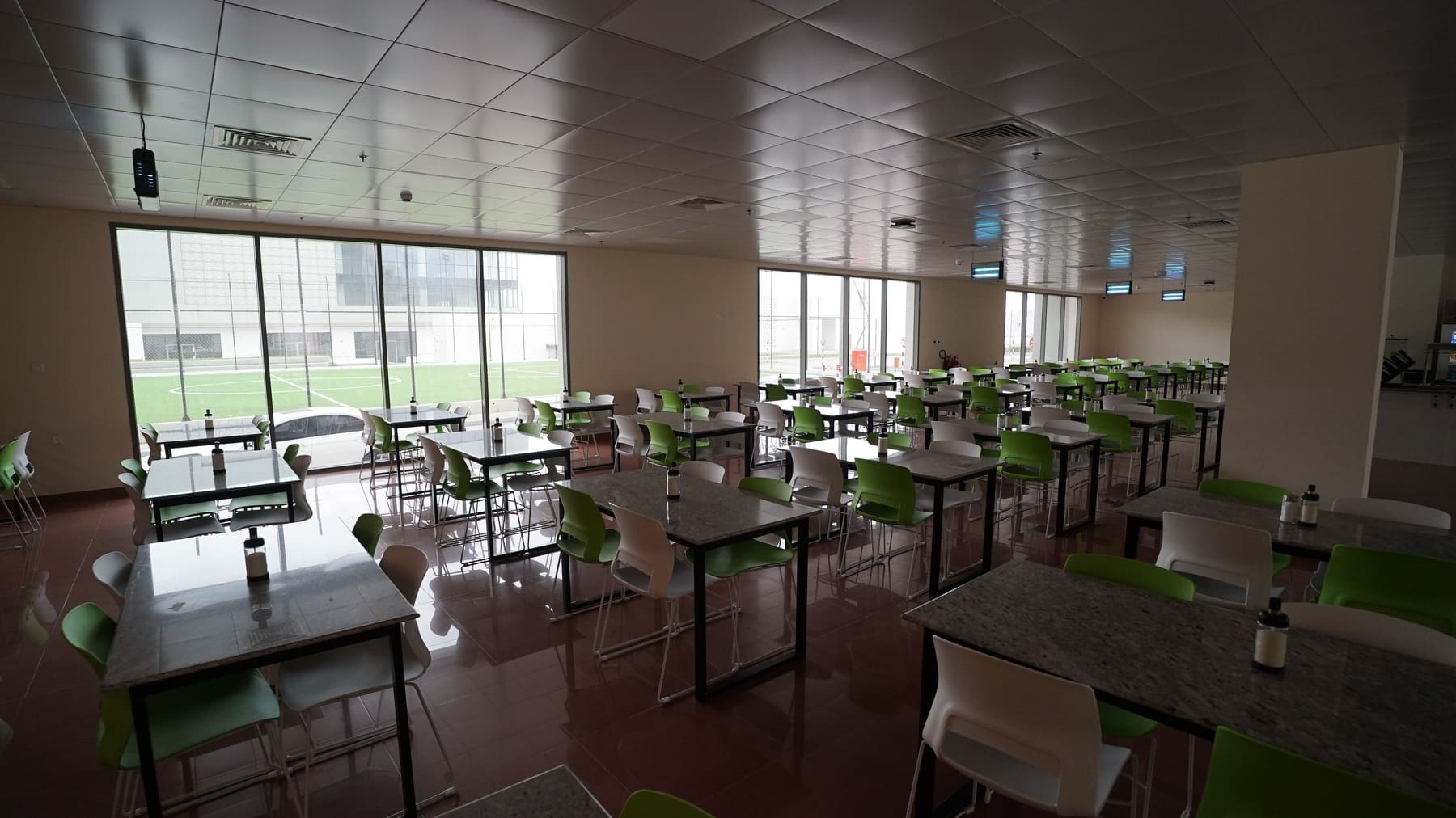 Café seating beside full-height windows